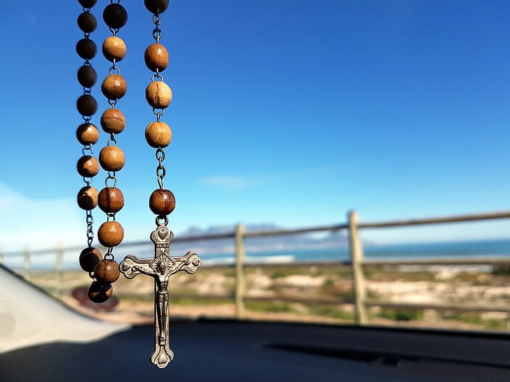 The Rosary Around Her Neck Caught My Eye