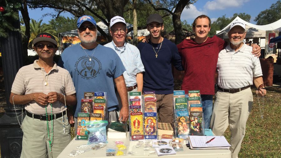 A trained SPSE team at their table with evangelization materials