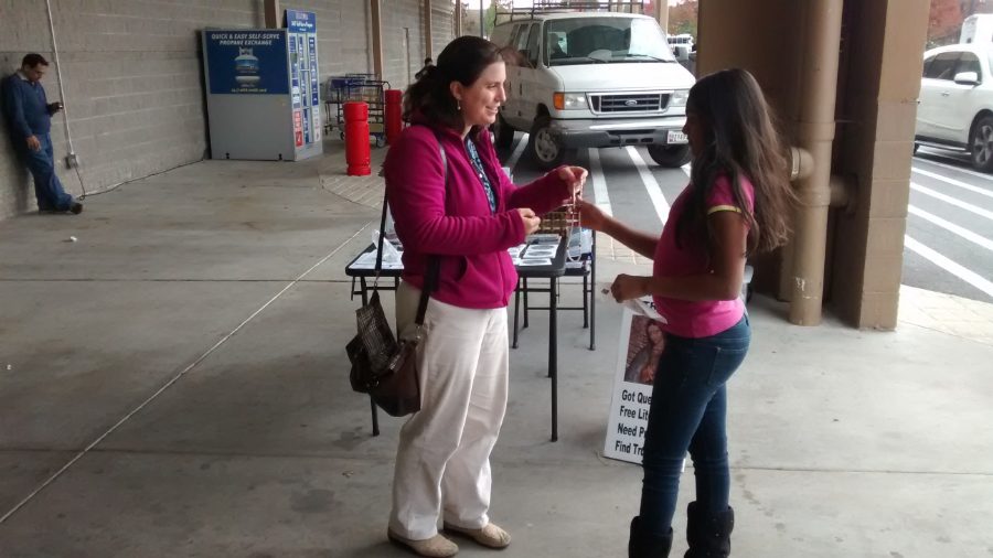 An SPSE evangelist in conversation with a passerby on the sidewalk